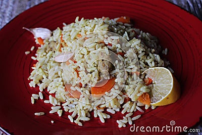 Plov. Vegan fresh tasty dish. rise with carrot, soya meat and garlic Stock Photo