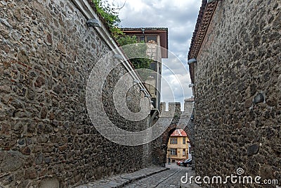 PLOVDIV, BULGARIA - SEPTEMBER 2 2016: Night photo of old houses and ancient fortress entrance of old town of city of Plovdiv Editorial Stock Photo