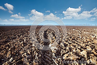 A plowed field and clouds Stock Photo