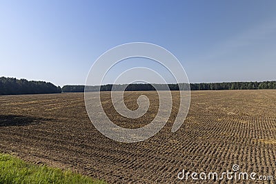 A plowed field with fertile soil for agricultural activities Stock Photo