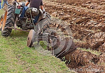 Plowing with an old plow Stock Photo