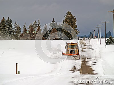 Plowing the Rural Road Stock Photo