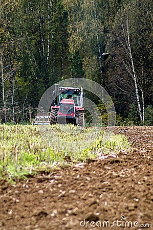 Plowing tractor. Editorial Stock Photo