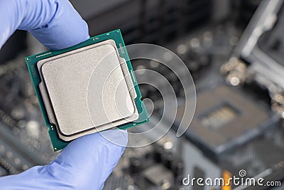 Plug in CPU microprocessor to motherboard socket. Technological background. Concept computers harware Stock Photo