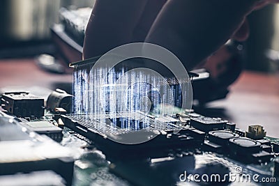 Plug in CPU microprocessor to motherboard socket Stock Photo