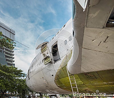 Plug Door of Big Jumbo Jetliner Aircraft Are Being Repaired or Under Maintenance at Open Air Hangar. Stock Photo