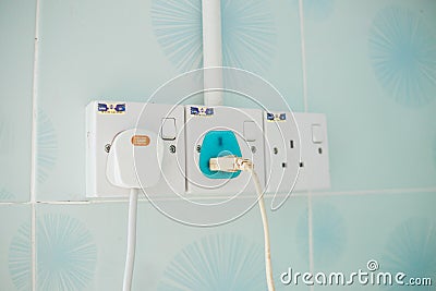 Plug the power plug with connected plugs Editorial Stock Photo