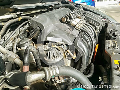 Plug and wiring of the liquid gas system installed on car engine. Stock Photo