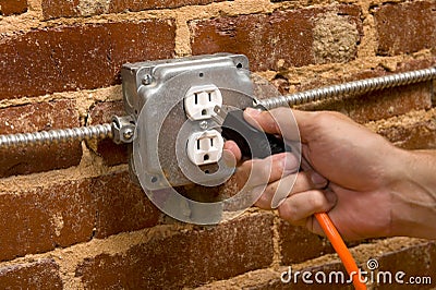 Plugging in an Extension cord Stock Photo