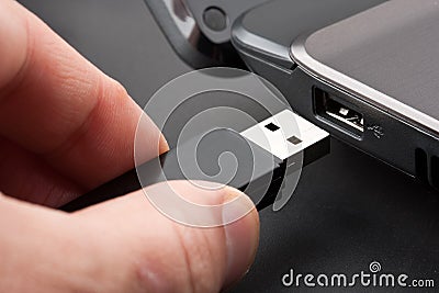 Plugging removable flash disk Stock Photo