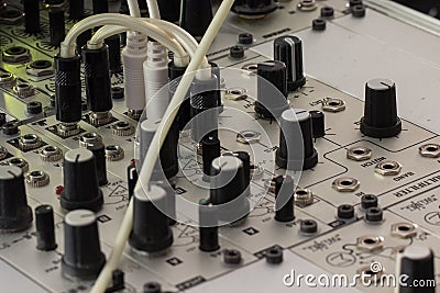 Plugs and knobs - modular synthesizer, analogue synth closeup Stock Photo