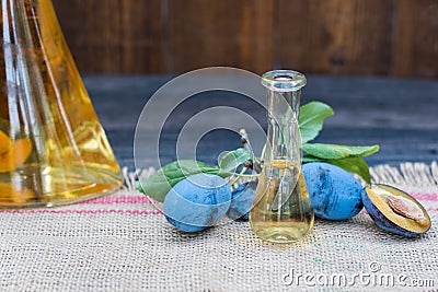 Plum brandy or schnapps with tasty and fresh plum fruit Stock Photo