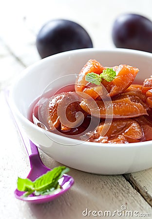 Plum compote in bowl Stock Photo