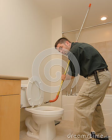 Plumber with auger Stock Photo