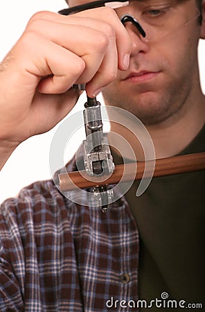 Plumber Cutting Pipe Stock Photo