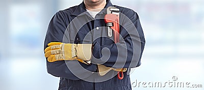 Plumber hand with wrench. Stock Photo