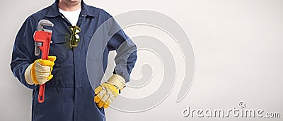 Plumber hand with wrench. Stock Photo