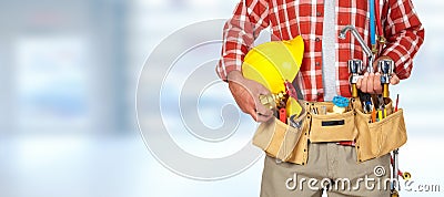 Plumber hands with helmet and water tap. Stock Photo