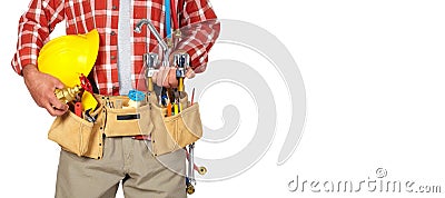 Plumber hands with helmet and water tap. Stock Photo