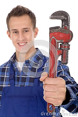 Plumber holding pipe wrench Stock Photo