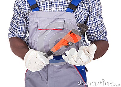 Plumber holding pipe wrench Stock Photo