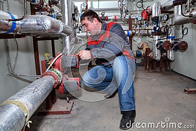 Plumber Installing Heating System Boiler Room Editorial Stock Photo