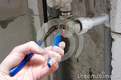 Plumber installing pipes Stock Photo