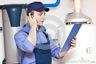 Plumber making a phone call Stock Photo