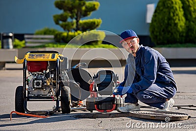 The plumber with portable camera for pipe inspection and other plumbing work Stock Photo