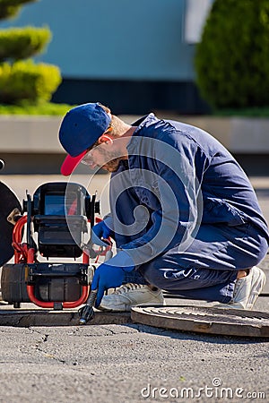 The plumber with portable camera for pipe inspection and other plumbing work Stock Photo