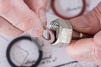 Plumber putting a gasket on a plumbing fitting Stock Photo