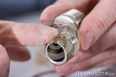 Plumber putting sealing paste on a thread Stock Photo