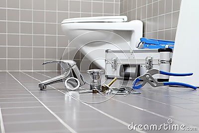 plumber tools and equipment in a bathroom, plumbing repair service, assemble and install concept Stock Photo