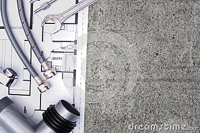 Plumbing equipment and a house plan Stock Photo