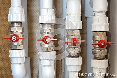 Plumbing white plastic pipes, fittings and ball valves Stock Photo