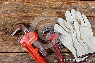 Wrench plumbing leather safety gloves construction concept Stock Photo