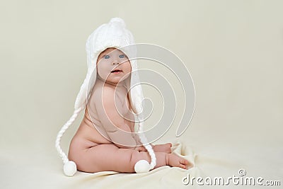 Plump satisfied child in a white hat Stock Photo