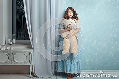 Plump woman with a bear in hands. Stock Photo