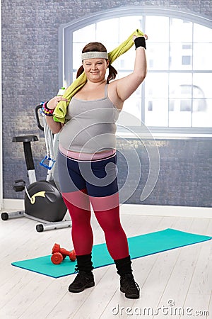 Plump woman at the gym smiling Stock Photo