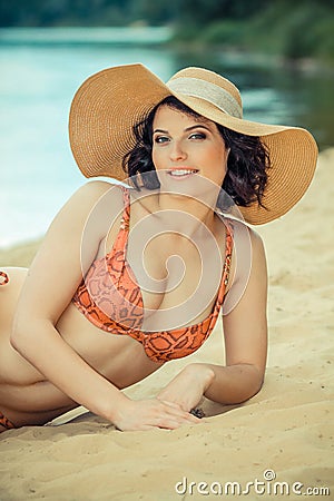 Plump woman sunbathing Stock Photo