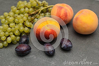 Plums, grapes, peaches. Still life with pears, grapes and plums. Healthy nutrition fruit delicious organic diet Stock Photo