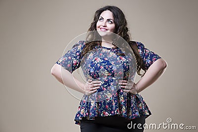 Plus size fashion model in casual clothes, fat woman on studio background, overweight female body Stock Photo
