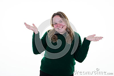 Plus size pretty woman shrugging with dumb puzzled expression in feeling annoyed and clueless in white background Stock Photo