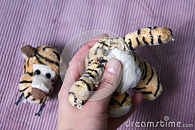 Plush tigger with a torn head. Torn toy Stock Photo