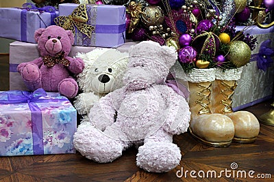 Plush toy bears under the Christmas tree with gifts and surprises Stock Photo