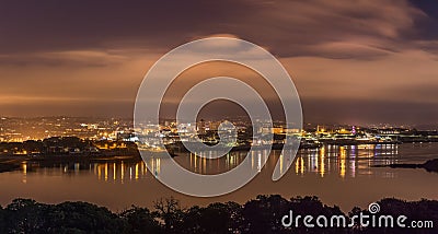 Plymouth City Panoramic Nightscape, with view across Plymouth Sound towards Smeatons Tower Lighthouse, Devon Stock Photo