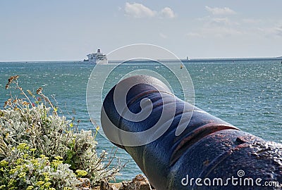 Large Canon Aimed at Passenger Ferry in Plymouth Harbor England Editorial Stock Photo