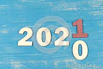 Plywood laser cutted numbers changing the year from 2020 to 2021. Merry Christmas and happy new year concept Stock Photo