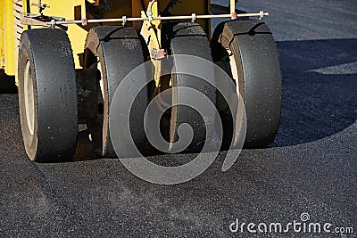 Pneumatic asphalt roller at work Stock Photo