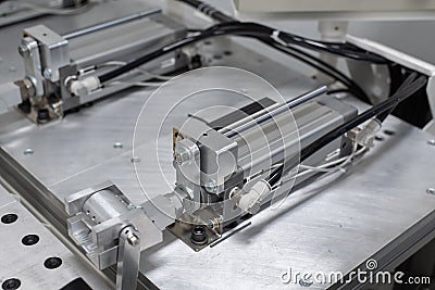 Pneumatic cylinder setup on machine Stock Photo